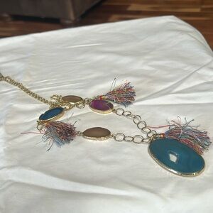 Gold tone chain.  16” with 2” extension      Pre-owned but, in good condition